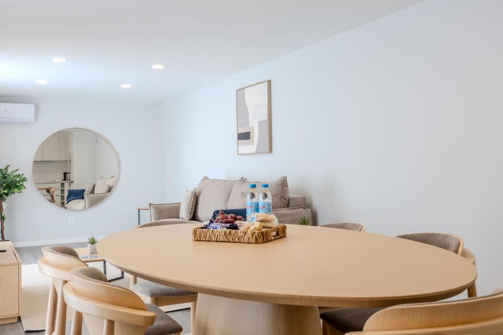 a living room with a table and chairs at Azor Signature Flats - I in Ponta Delgada