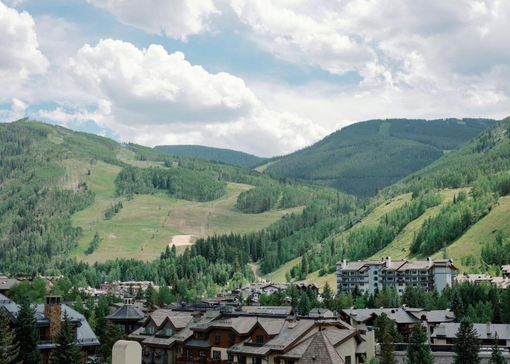 a town in a valley with mountains in the background at The Sebastian - Vail in Vail