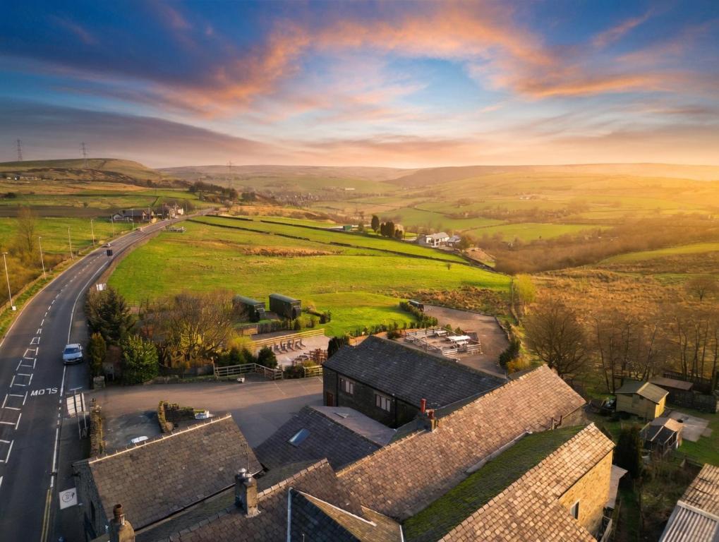 an aerial view of a village with a road at Grains Bar Hotel in Oldham