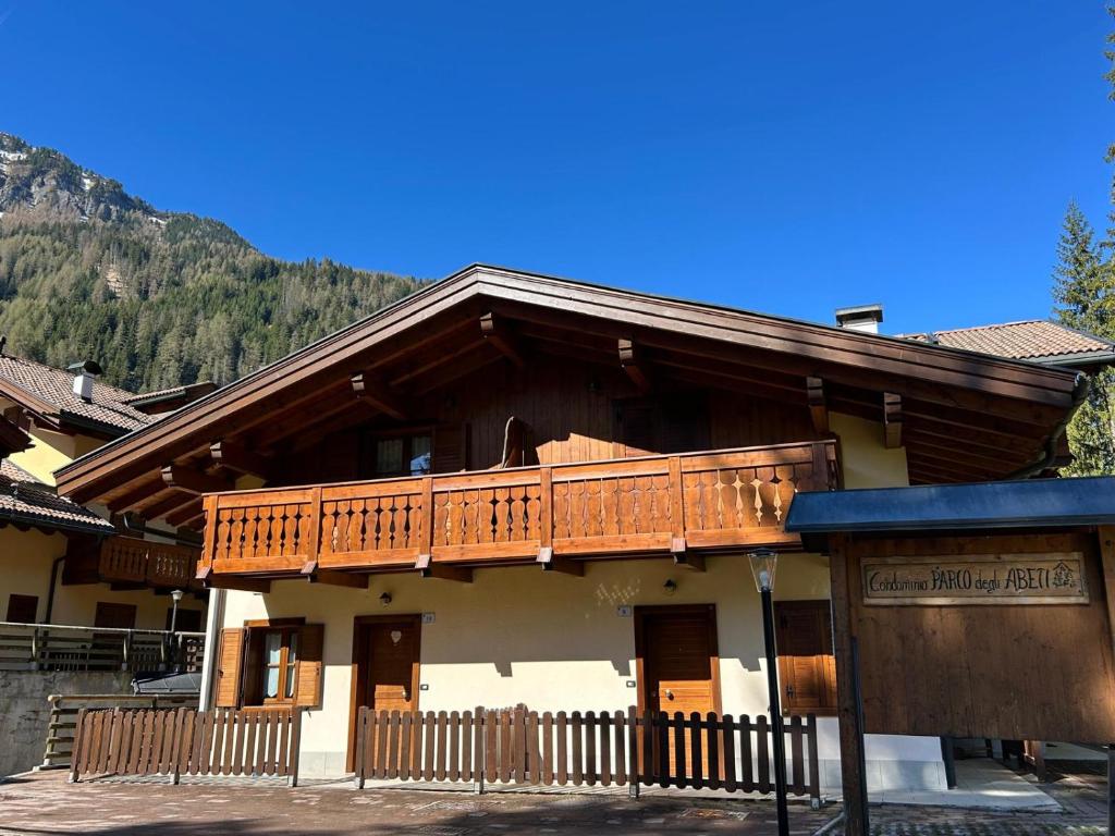 a large building with a balcony on top of it at Cèsa Aurora in Canazei