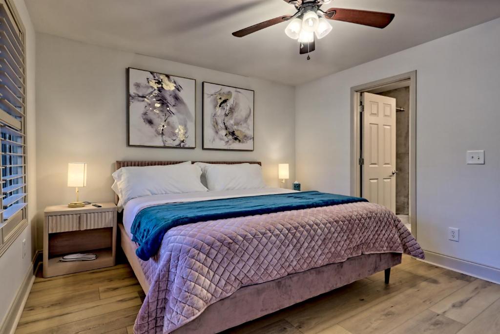 a bedroom with a bed and a ceiling fan at Alpine Studio in Helen
