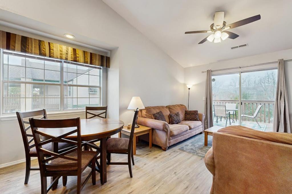 a living room with a table and a couch at Lantern Bay Retreat in Branson