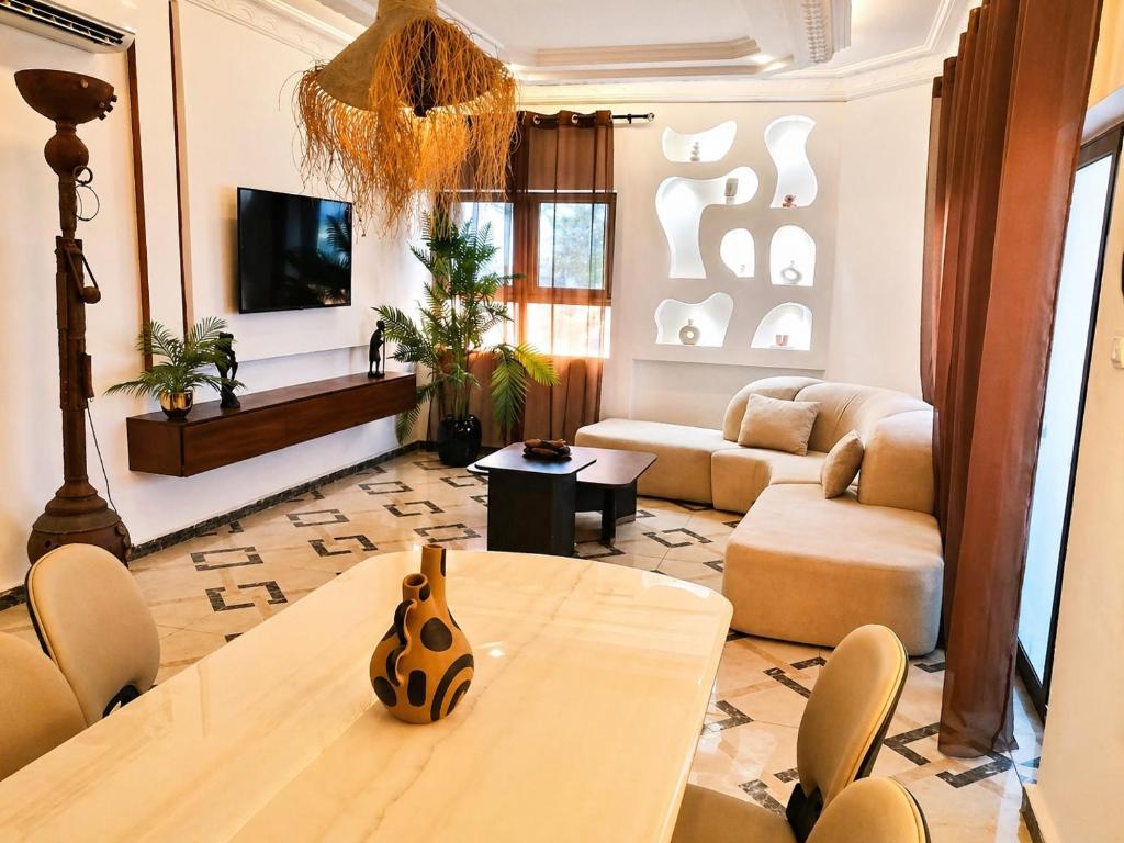 a living room with a table and a couch at Kaz An Nou in Kika