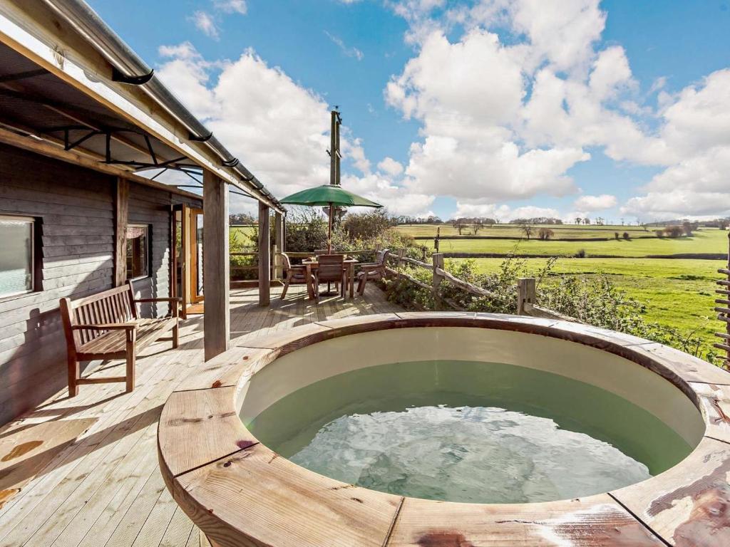 a hot tub on the deck of a house at 2 Bed in Lutterworth oc-93762 in Boughton