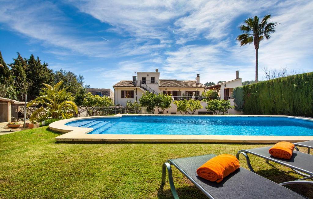 a swimming pool in the backyard of a house at Ca Na Rosa De Selva in El Port de la Selva