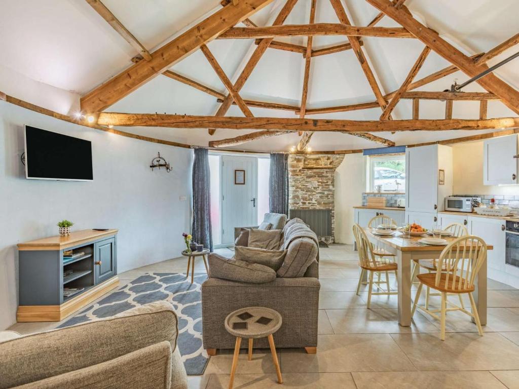 a living room with a couch and a table at 2 Bed in Bideford oc-60765 in Buckland Brewer