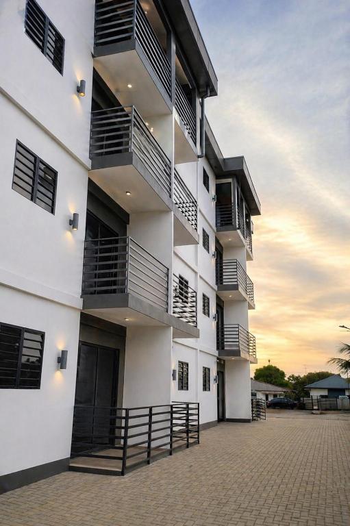 a building with balconies on the side of it at Southgate Residence in Paramaribo
