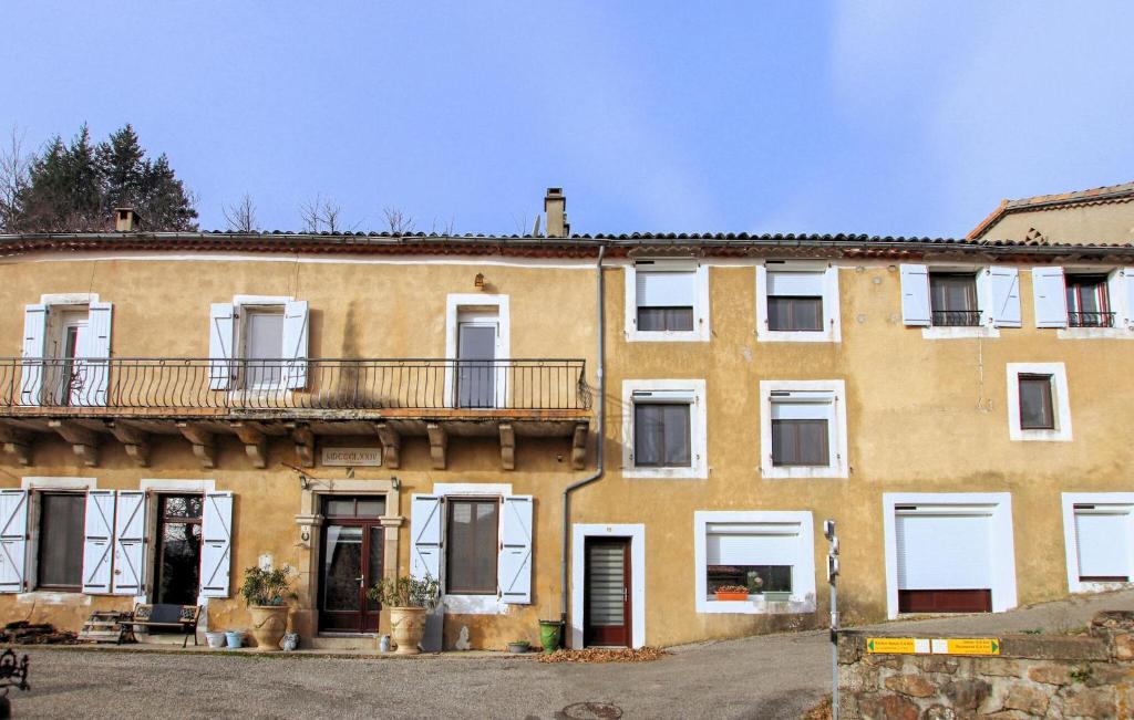 a large building with a balcony on the side of it at La Terrasse in La Pervenche