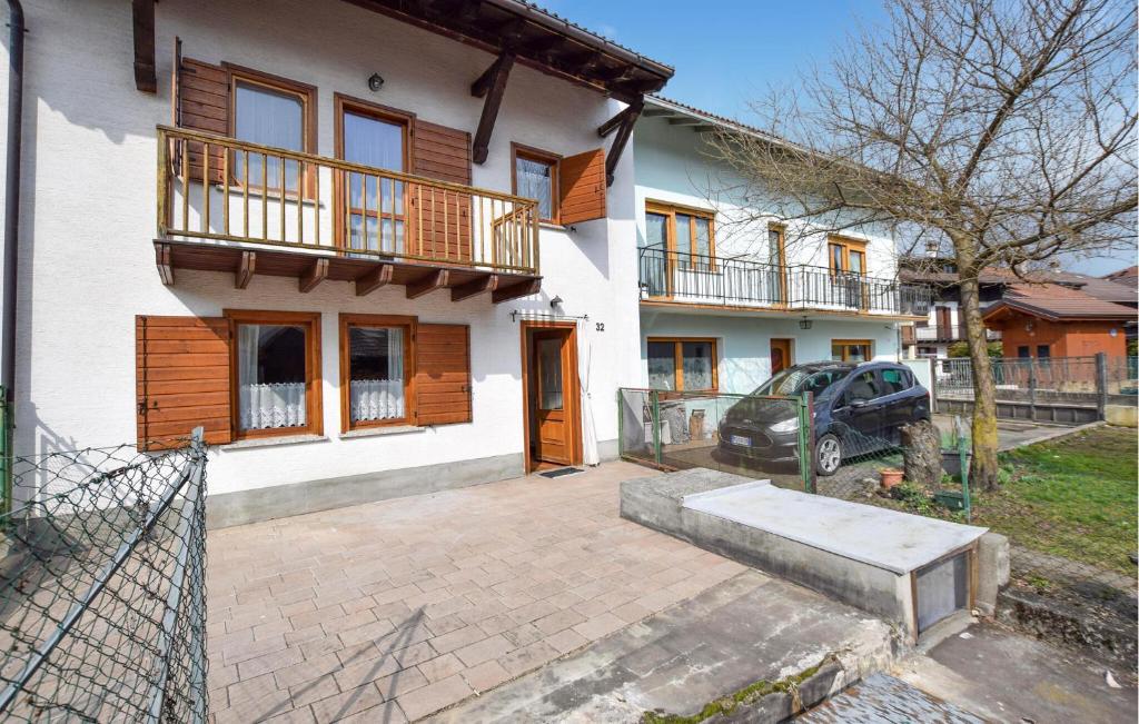 a house with a car parked in front of it at Ca' Piero in Lamon