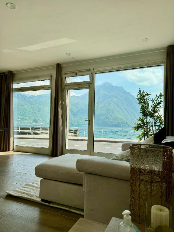 a living room with a couch and large windows at Paradise Lake View in Castro