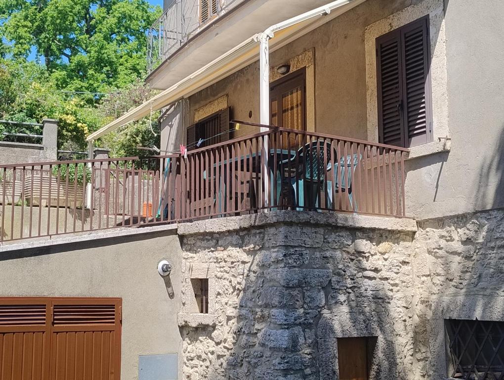a balcony of a building with a bench on it at Casa Bonaccorsi in Civitella Del Lago