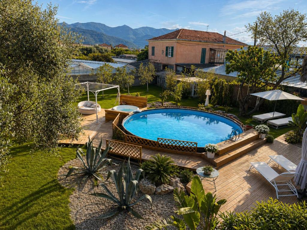 an overhead view of a swimming pool in a yard at Villa Irabo in Albenga