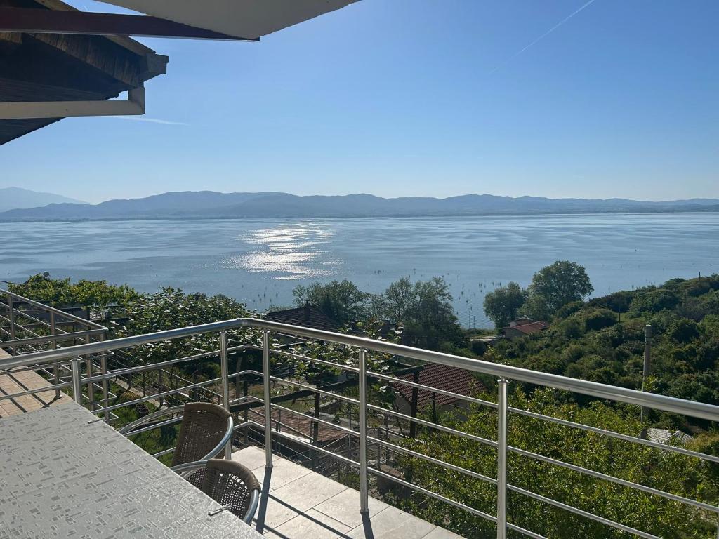 a balcony with a view of the water at Apartment Mila in Nov Dojran