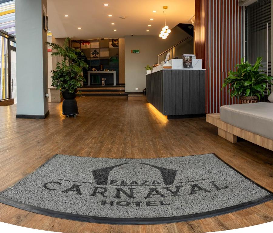a rug on a wooden floor in a room at Hotel Plaza Carnaval in Pasto