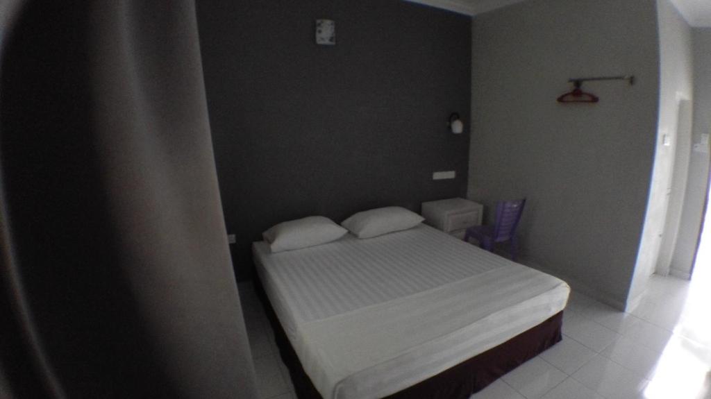 Postel nebo postele na pokoji v ubytování TEBiNG Guest House Taman Negara Malaysia Kuala Tahan