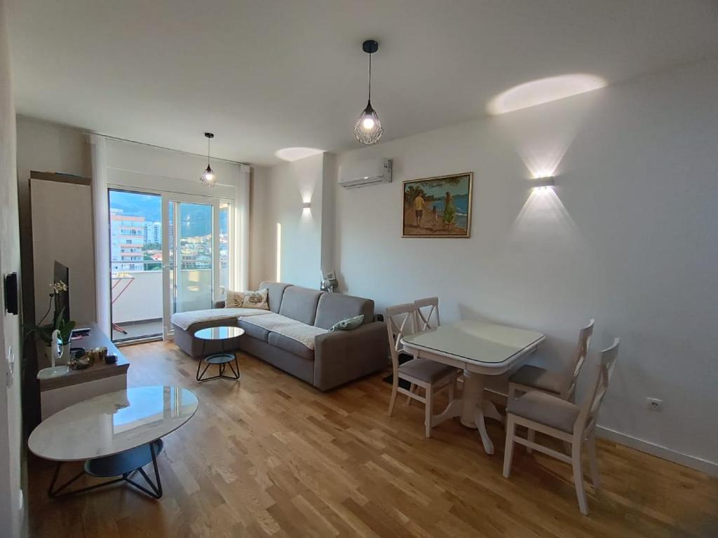 a living room with a couch and a table at Family Home Apartment in Bar