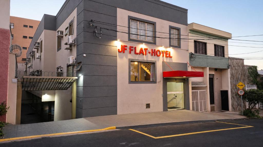 a building with a sign that reads fitz taco at JF Flat - Hotel in Ribeirão Preto