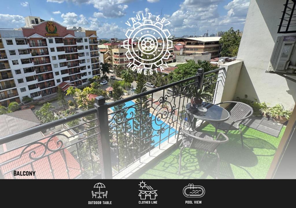 a balcony with a table and chairs on a building at Vault 607 Homestay in Davao City