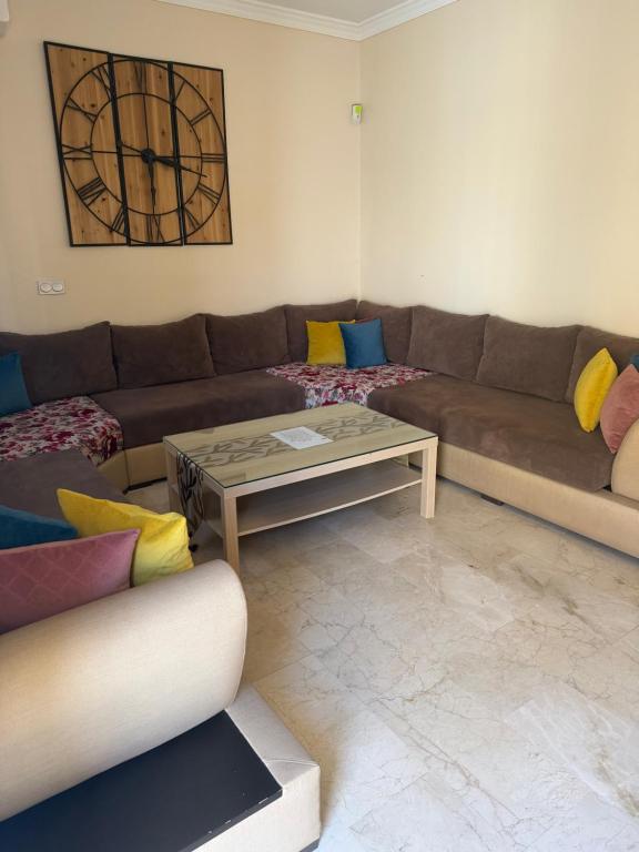 a living room with a couch and a table at Apartamento nora in Ceuta