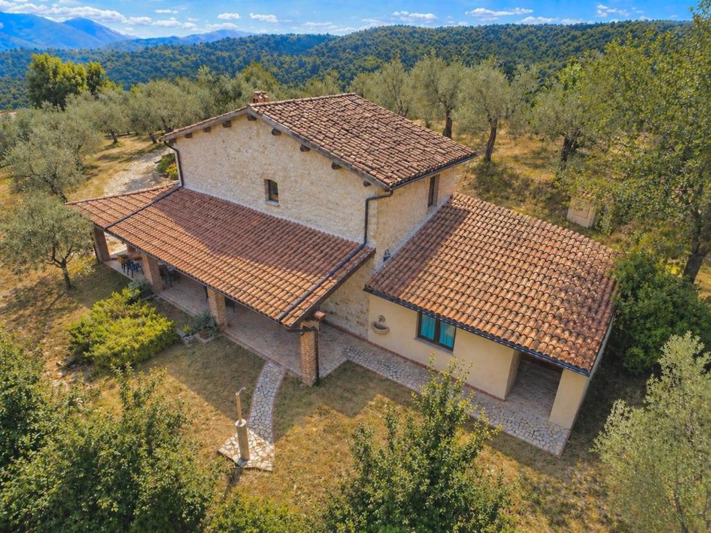 an aerial view of a house with two roofs at VILLA NOCRI - Villa Privata con Piscina & Sauna in Montefranco