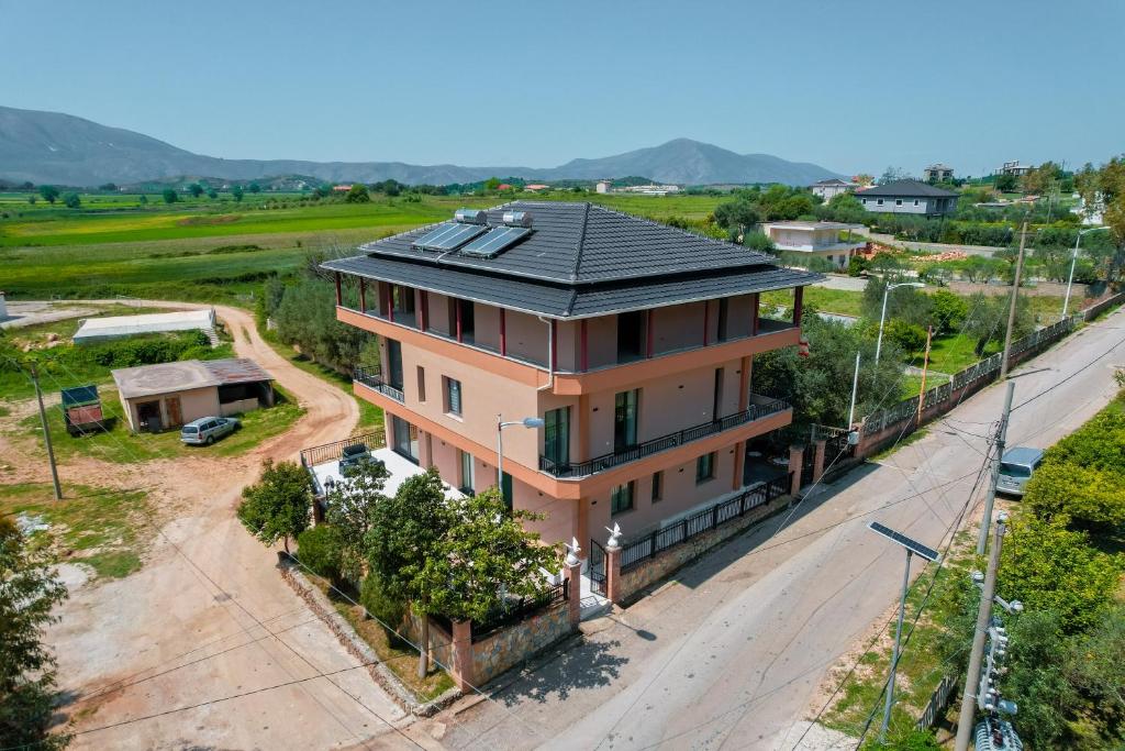 an overhead view of a house with a black roof at Riverside Villa in Tragjas