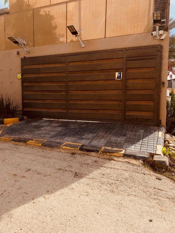 a garage door with two lights on top of it at Villa karma in Al Rama