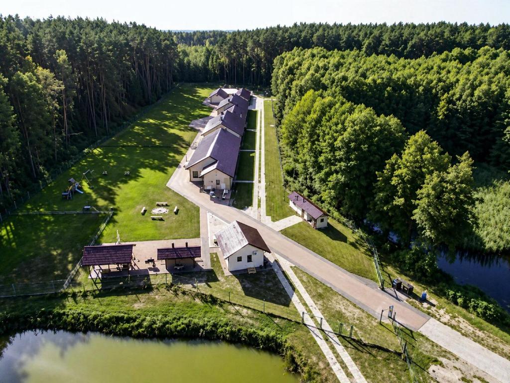 an aerial view of a house on an island in a lake at Gościniec nad Dobrzycą in Wałcz