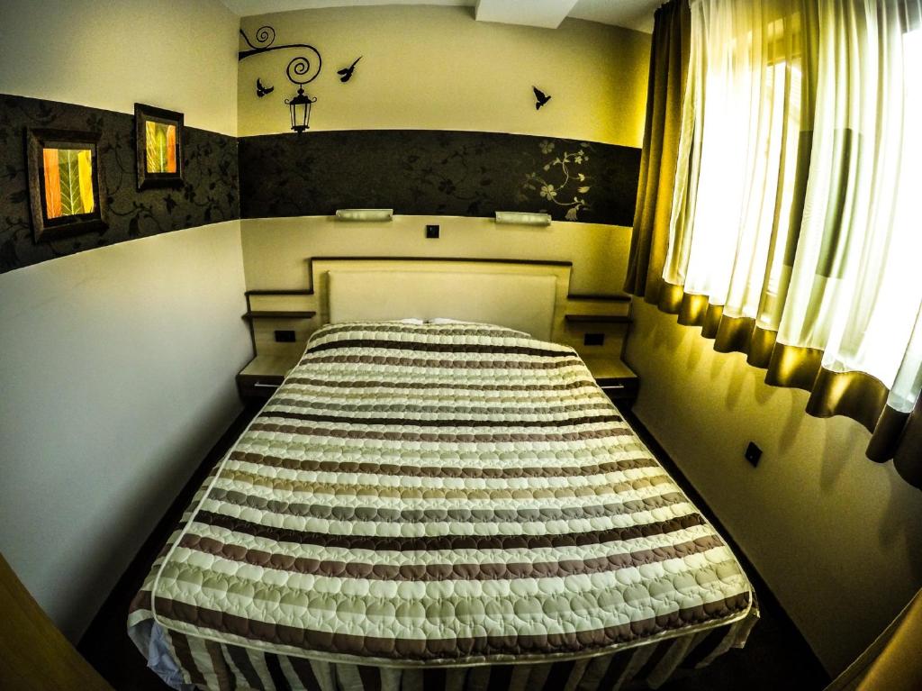 Postel nebo postele na pokoji v ubytování SM Apartments Kopaonik