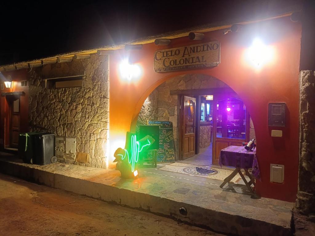 an entrance to a building at night at Cielo Andino Colonial in Purmamarca