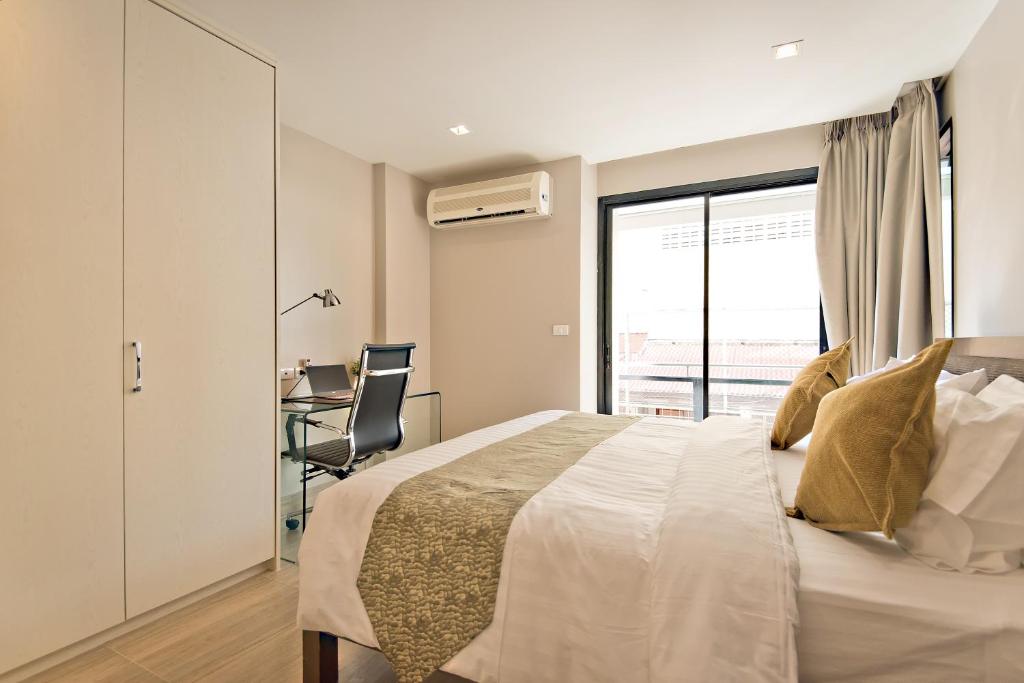 Postel nebo postele na pokoji v ubytování Citismart Luxury Apartments