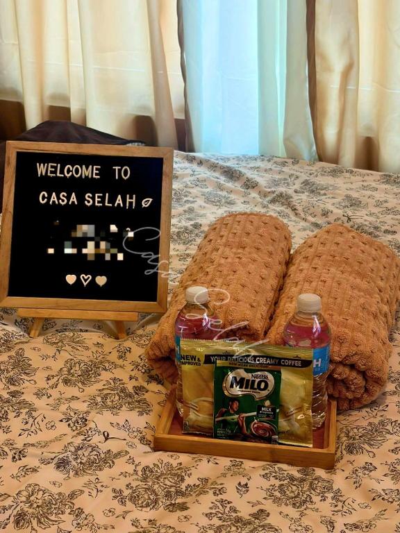 a welcome to casa sellah sign and bread on a table at Aurora Escalades in Manila