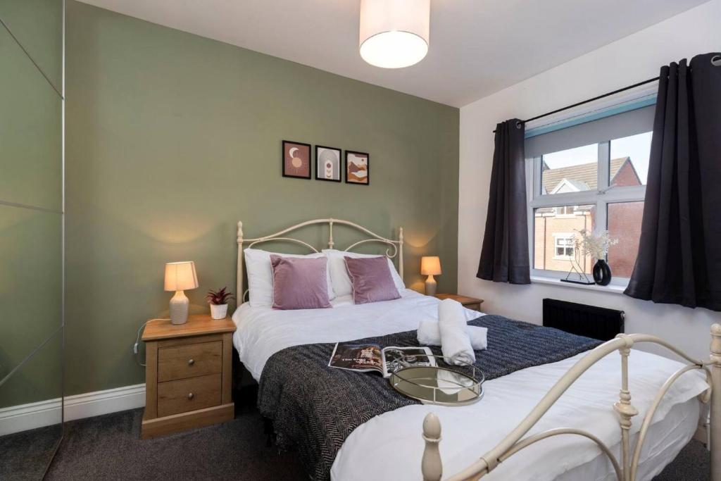 a bedroom with a bed and a window at DiscountsContractorsWIFIFree ParkingSmart TV in Gateshead