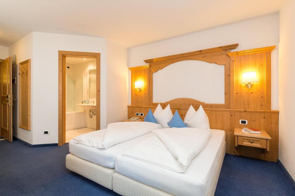 Postel nebo postele na pokoji v ubytování Hotel Bel Sit
