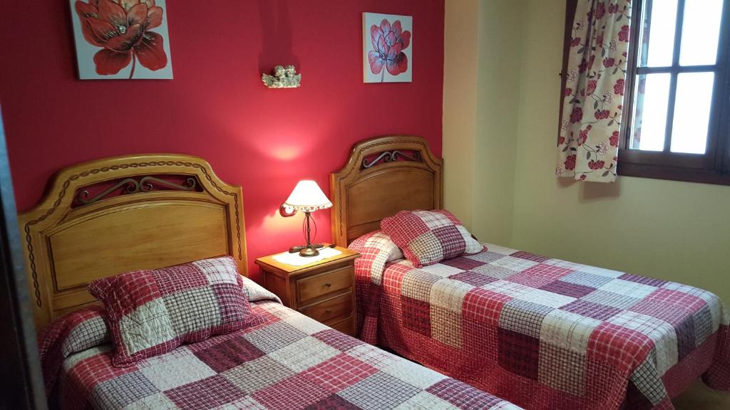 Posteľ alebo postele v izbe v ubytovaní Apartamentos Rurales Tauro
