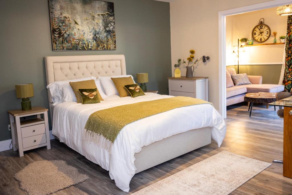 a bedroom with a bed and a living room at The Wheelhouse, Ballycastle in Ballycastle