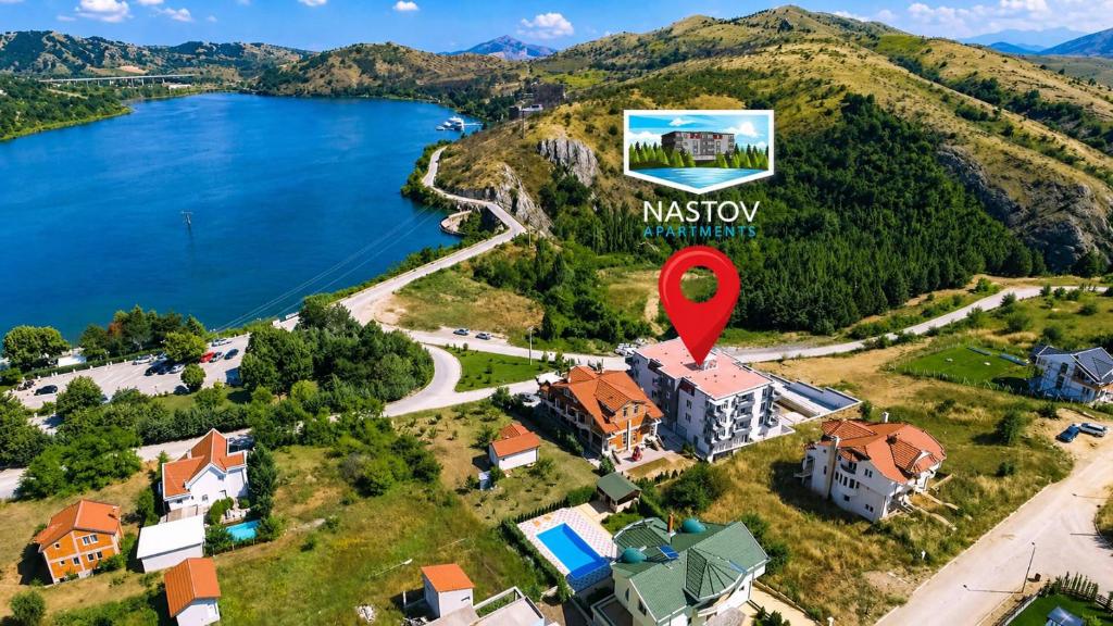 an aerial view of a house on a hill with a red marker at Nastov Apartments in Veles