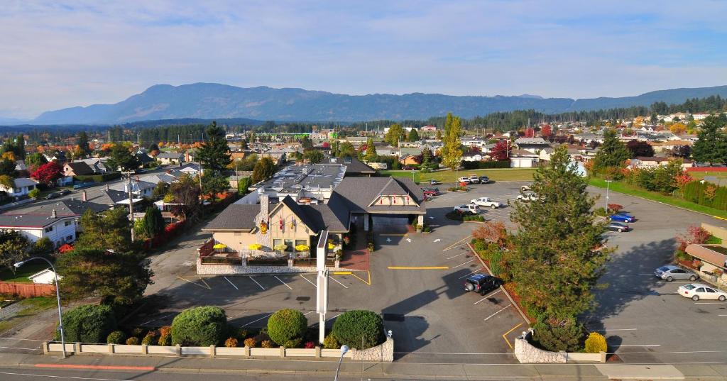 an aerial view of a town with a parking lot at The Hospitality Inn in Port Alberni