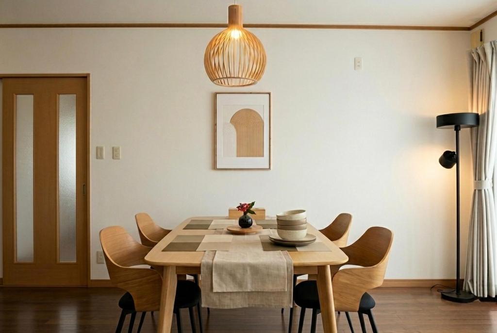a dining room with a table and chairs at 結-musubi- in Miyazaki