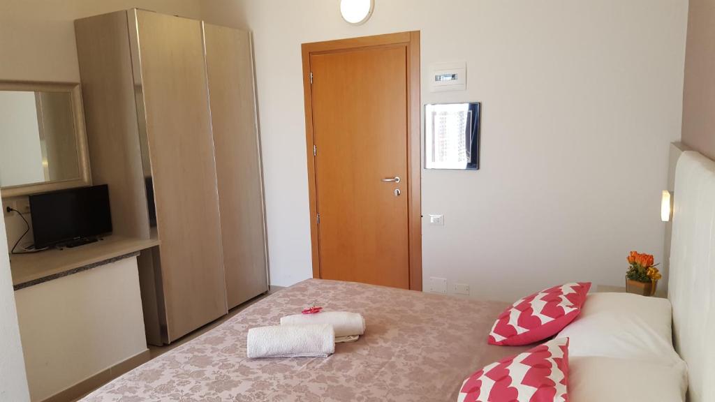 Postel nebo postele na pokoji v ubytování Hotel Raffaello