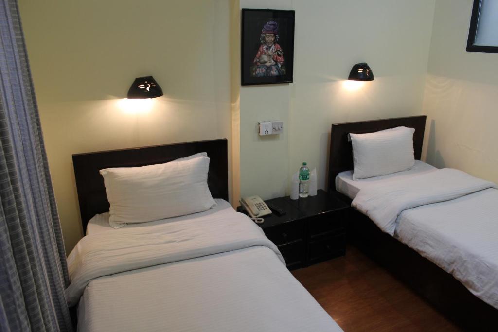 Postel nebo postele na pokoji v ubytování Hotel Buddha Land