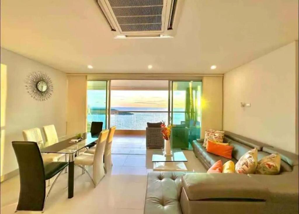 a living room with a couch and a table at Large 3BR Apt with beautiful ocean views in Cartagena de Indias