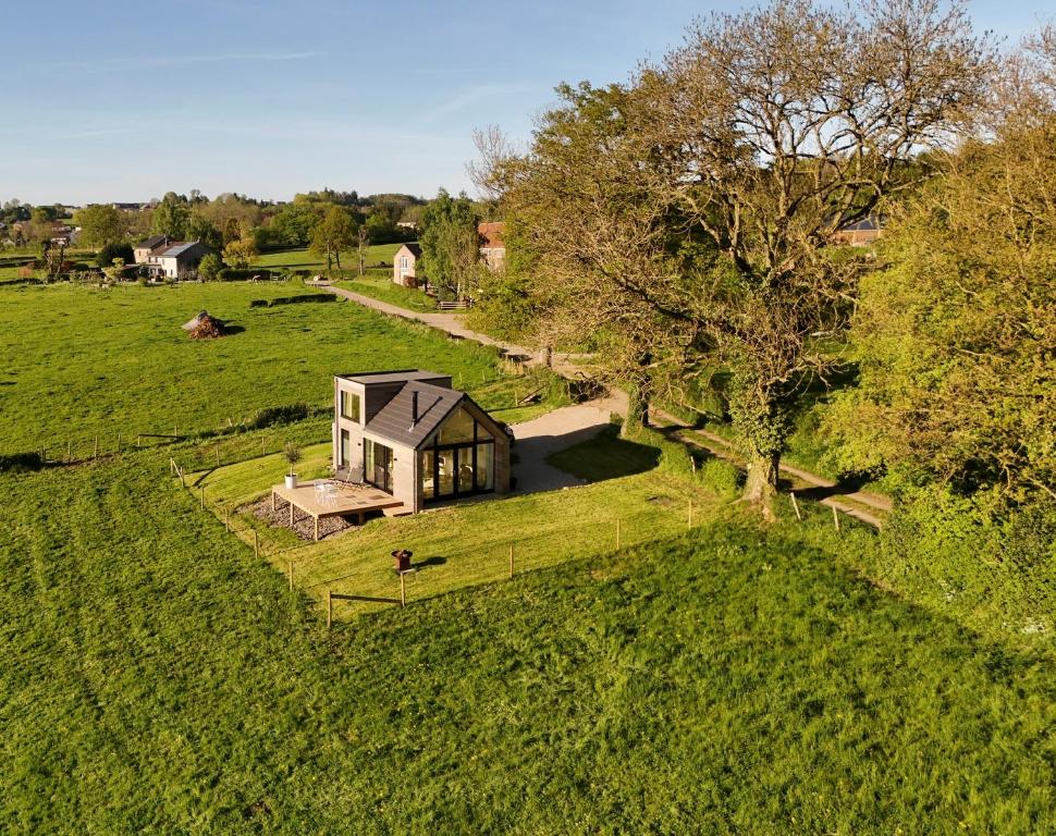 an aerial view of a house in a field at La Cabane LeLa in Theux