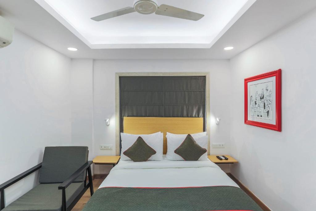 a bedroom with a bed and a ceiling fan at Townhouse Habitat New Town Rooms & Party Spaces in Kolkata