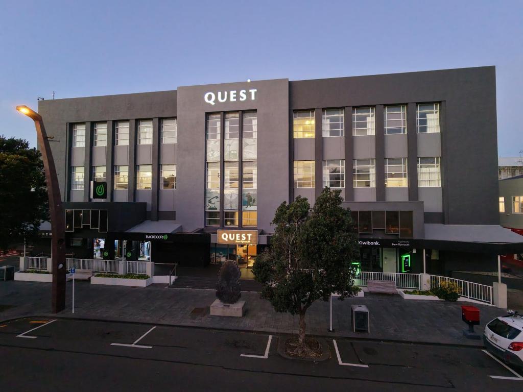 a quest building with a car parked in front of it at Quest New Plymouth CBD Apartment Hotel in New Plymouth