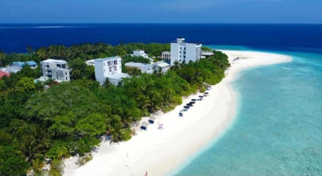 an aerial view of a beach with houses and the ocean at Ukulhas Villa Hotel & Spa in Ukulhas