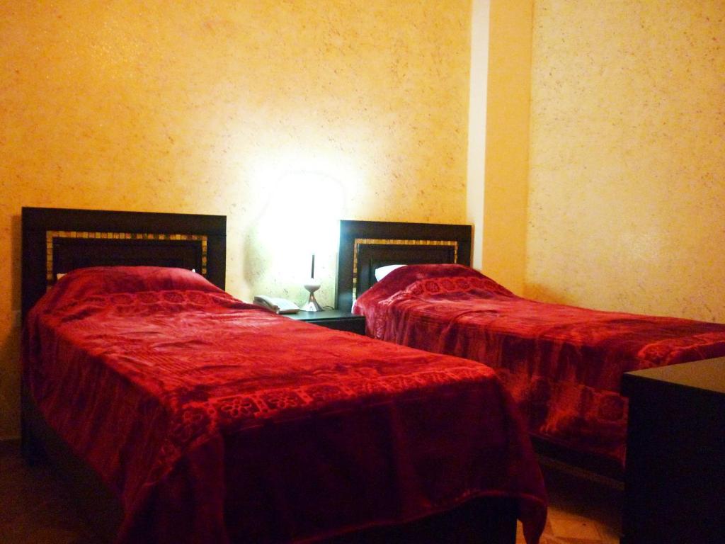 Postel nebo postele na pokoji v ubytování Isra Hotel