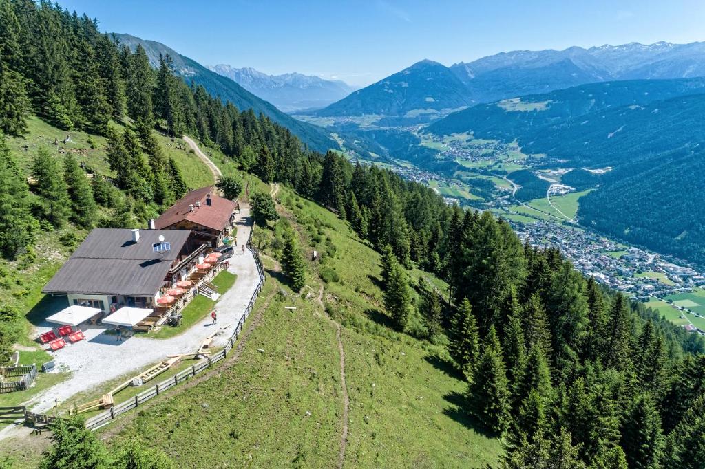 an aerial view of a house in the mountains at Galtalm in Fulpmes