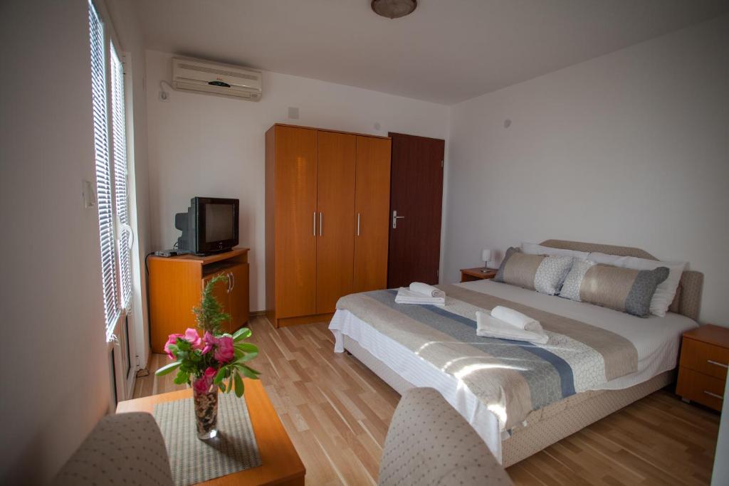 Postel nebo postele na pokoji v ubytování Panorama Apartments