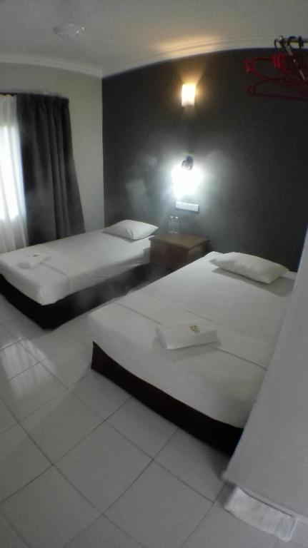 Postel nebo postele na pokoji v ubytování TEBiNG Guest House Taman Negara Malaysia Kuala Tahan