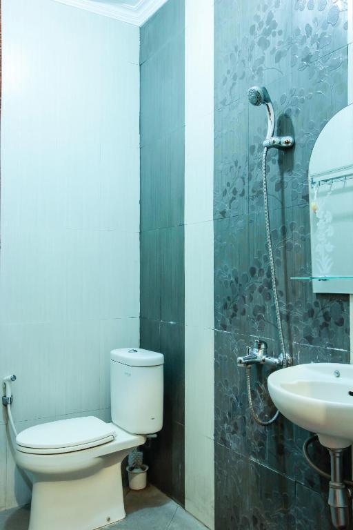 Koupelna v ubytování Griya Langen Guesthouse